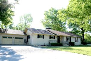 Spacious, 4 BD,2 1/2 baths,2835 SF home on 4 lots. Huge great room, fireplace,central vac.2 master suites. 1 BR has fire place , hidden wall mounted bed-used as library or guest room.formal dining,lg. kitchen with breakfast bar, walk-in pantry. oversized garage, work shop, plenty storage. lg., fully privacy fenced back yard with rv gate and pad.