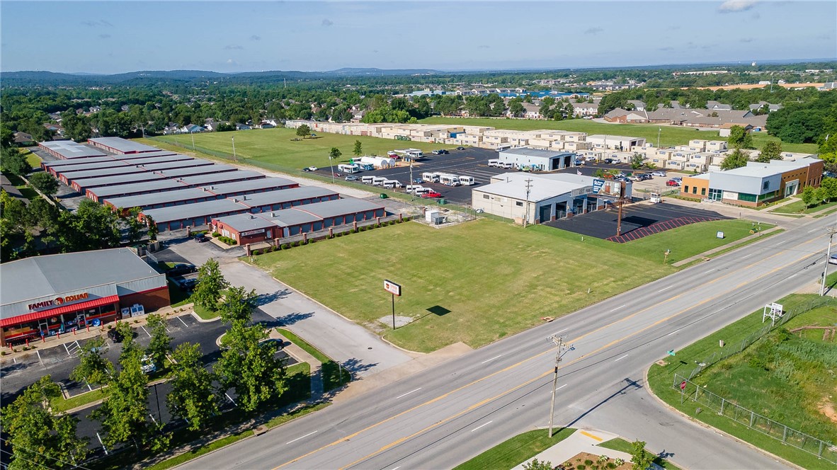 Flat, easily accessible east Springdale commercial lot, zoned C-2. Two (2) curb cuts on access off E. Robinson/412E for simple ingress/egress, and located in one of Springdale's Opportunity Zones.