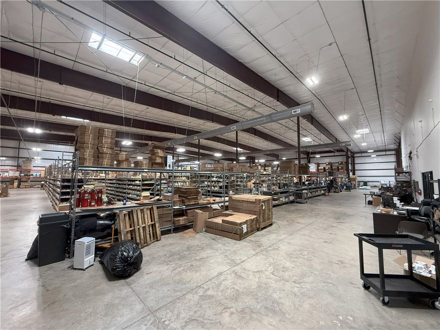 For Sale – 33,000+ SF Warehouse/Office at 252 W Hudson Rd, Rogers. Built in 2024, this like-new facility offers approx. 28,000 SF clear-span warehouse and a two-story, 5,000+ SF office space. Modern design with high ceilings, bright LED lighting, polished concrete floors, and multiple grade-level overhead doors for efficient loading/unloading. Office includes reception, conference rooms, private offices, break areas, and restrooms. Ample paved parking and excellent truck access. Located in a prime Rogers industrial corridor with easy access to I-49 and major regional routes. Offered at $6.5M—ideal for owner-occupant or investment.