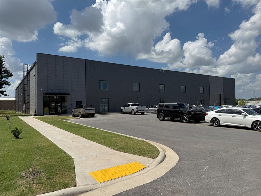 For Sale – 33,000+ SF Warehouse/Office at 252 W Hudson Rd, Rogers. Built in 2024, this like-new facility offers approx. 28,000 SF clear-span warehouse and a two-story, 5,000+ SF office space. Modern design with high ceilings, bright LED lighting, polished concrete floors, and multiple grade-level overhead doors for efficient loading/unloading. Office includes reception, conference rooms, private offices, break areas, and restrooms. Ample paved parking and excellent truck access. Located in a prime Rogers industrial corridor with easy access to I-49 and major regional routes. Offered at $6.5M—ideal for owner-occupant or investment.