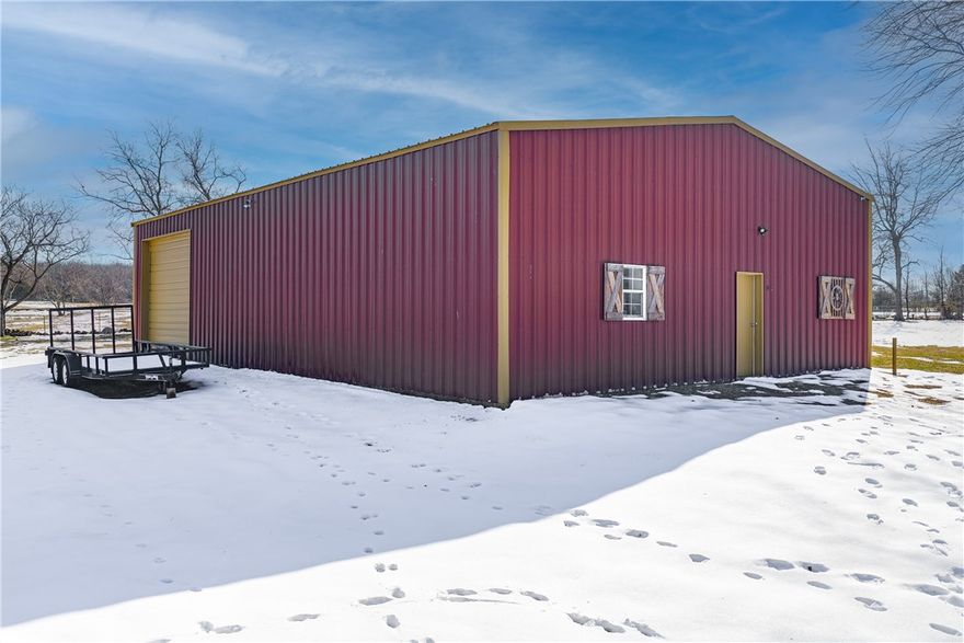 Discover an exceptional commercial/residential opportunity on 1.36 acres in Lincoln, Arkansas! This mixed-use property on W Holt Road features a large 40x60 shop building complete with a bathroom and office space—everything you need to start your business from day one. The property offers excellent infrastructure with public water, existing septic, and electric service already available. Situated on open, level terrain with three-side fencing, the land features a pond and wet weather creek adding natural beauty. Paved road frontage ensures convenient access, and there's a manufactured home on the property providing additional flexibility. Located in the Lincoln School District, this turnkey property combines peaceful rural surroundings with quick connectivity to Northwest Arkansas. Whether you're planning a contracting business, automotive shop, or storage facility, this property is ready for you to make it your own!