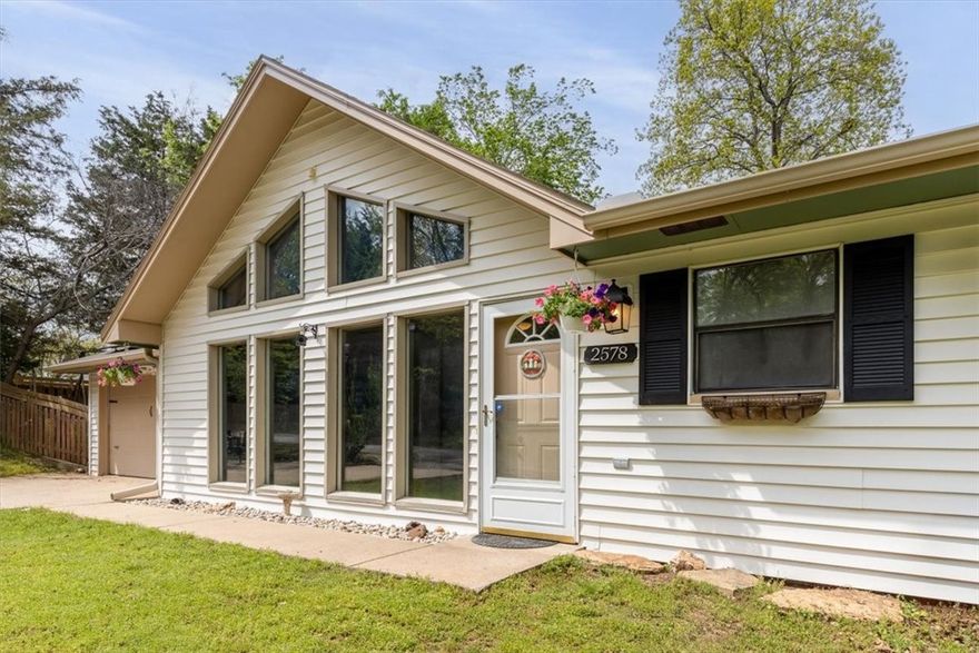 This amazing one-level home is perfectly situated in the heart of uptown Fayetteville, offering convenient access to shopping, schools, dining, and retail. Featuring three bedrooms & two bathrooms, the classic floor plan includes a formal living room with a cozy fireplace and stunning floor-to-ceiling windows that follow the line of the vaulted ceiling, filling the space with natural light. The kitchen is complete and open, with a spacious eat-in area perfect for everyday living. Bamboo flooring runs throughout the entire home, including all three bedrooms. The primary suite is generously sized and includes a separate area ideal for a reading nook or home office. Enjoy the large corner lot with mature trees & take advantage of the neighborhood’s recently updated community pool & nearby trail access. As an added bonus, the home boasts energy efficient solar panels, resulting in a low electric bill each month. Recent updates include new kitchen countertops, hardwood floors, roof, HVAC, & French drain in back yard.