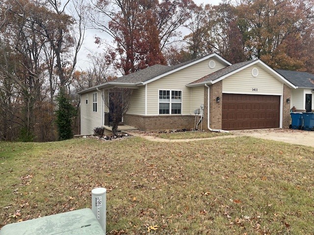 Can't beat this location! Minutes from the new Walmart campus, and all of the downtown amenities, right off I-49, and within walking distance of some of the best mountain biking trails in NWA. This home has a new roof, new AC unit and furnace, new water heater, and brand-new appliances. New garage door and opener just installed. Great view off the back porch with plenty of trees and privacy. Don't let this one slip away!