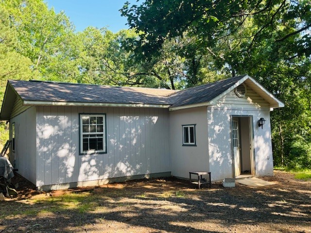 Discover comfort and privacy in this beautifully updated 2-bedroom, 1-bath all-electric home nestled on a surveyed 1.17-acre wooded lot. Enjoy energy efficiency with new attic insulation, resealed doors and windows, a programmable thermostat, and central HVAC. The home features ceramic tile throughout, a durable roof less than 10 years old, and a handy mud room. Surrounded by nature yet just minutes from town—this gem blends modern convenience with peaceful seclusion.