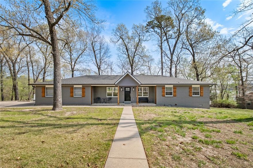 The perfect Beaver Lake getaway! 4 SLIP BOAT DOCK (2-10x26 and 2-10x12), COMPLETELY REMODELED, 4bdrm, 3 bath home nestled in Beaver Shores w/ gorgeous views overlooking the quiet cove from the wall-to-wall windows along the back of the house. Designed to entertain, the kitchen, dining & living room are all open to one another & steps away from the oversized upper & lower deck w/ fire pit, built for taking in all the lake life has to offer! Large game room/bonus room downstairs make this the ultimate home for all of your Beaver Lake fun! 24x36 shop w/ heaters & fans, new roof, new HVAC & whole house/shop generator hookup.
