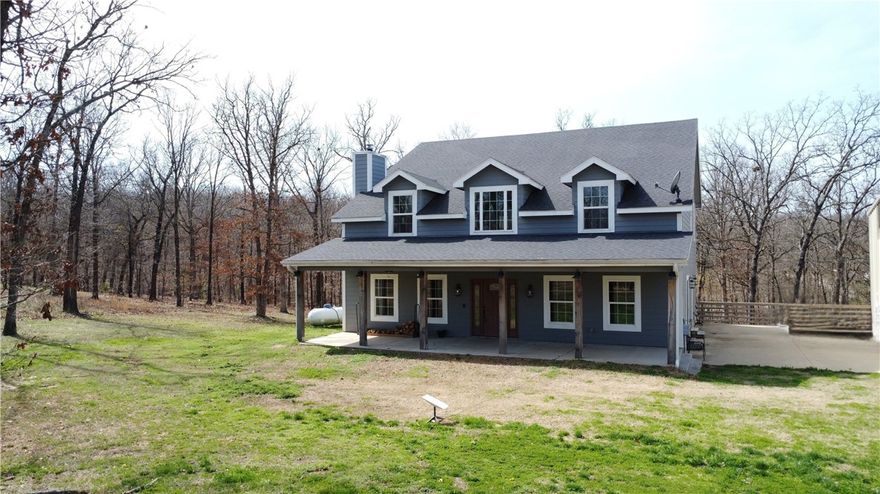 Welcome to the perfect blend of space, functionality, & wide-open country living. This 2,781 sq ft home sits on 3.16 peaceful acres offering room to breathe, work, & play—indoors & out. The real star of the property is the massive 40x60 shop, ideal for mechanics, hobbyists, or small business owners. The shop is fully insulated, has a propane heater, 3-12x14 bay doors, full bath & a 2 post lift that could be negotiated into the sale! Inside the home, you’ll find generous living areas designed for comfort & everyday living, w/plenty of room for family, guests, or entertaining. The master suite has new carpet, huge walk-in shower, large corner tub, & tons of closet space. The kitchen offers all stainless steel appliances & the island has a custom Black Walnut Island Top w/Merlow Red Epoxy River from Ol Loggin Sawmill here in Gravette! Fresh Paint in Jan 2026, including walls, doors, & trim & the staircase is freshly stained. Tile & Carpets were professional cleaned & 1 year Home Warranty make this 100% move in ready!