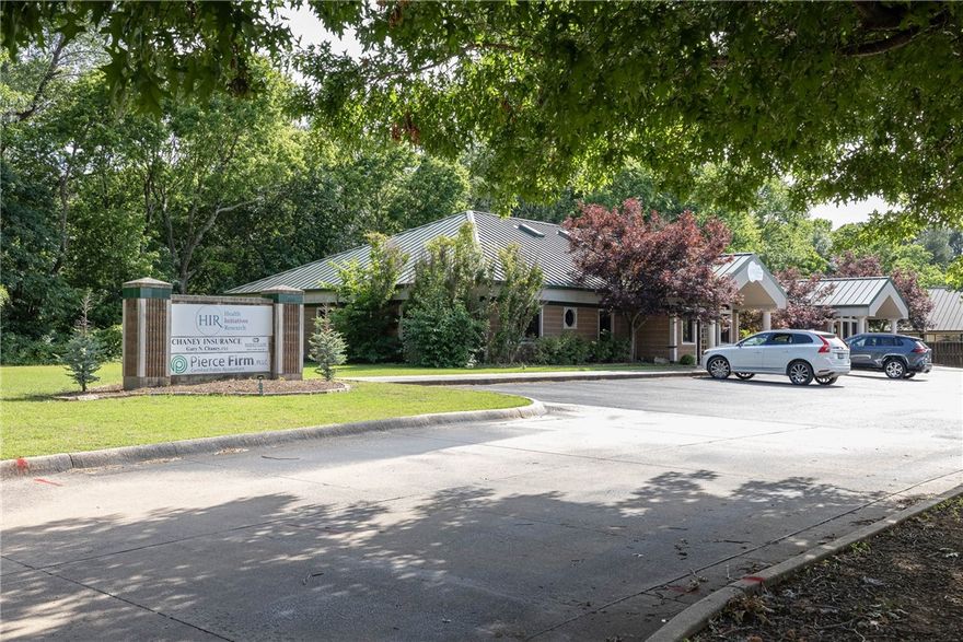 Great office building in Prime Fayetteville location. Most recently used as a medical clinic, the floorpan is set up with a reception area, waiting room, two  executive offices, 9 auxiliary offices, break room, copy room, three bathrooms and a 31' x 16' 2nd level flex space. 17 parking spaces and room to potentially add extra square footage with a large corner lot. High traffic area.