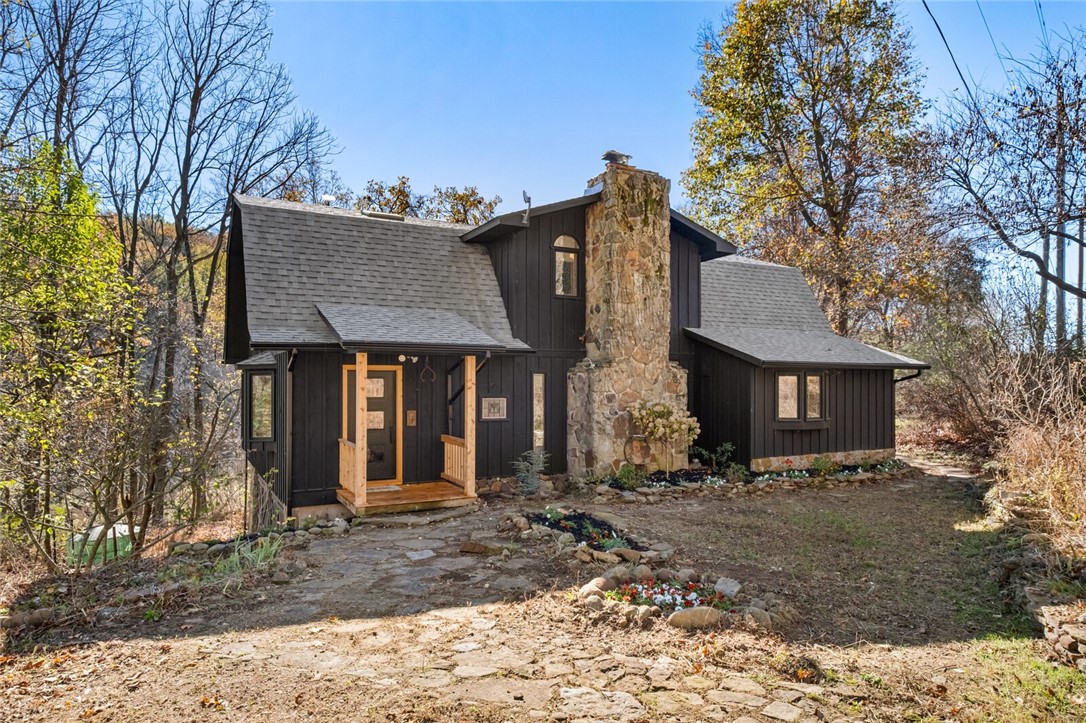 This unique European cottage/cabin draws you in to a peaceful, simple life on 10 private acres without sacrificing the beauty of high end finishes!The cabin is a perfect mix of old character, & new sophistication. Every detail was carefully curated with this renovation;from the quartz countertops that carry up the backsplash,to the hand bleached oak flooring, every selection was thoughtfully designed w/ forever in mind.The timeless style creates a cozy ambiance that can be cherished for years to come.This cottage has plenty of room for entertaining friends & loved ones.The master suite boasts a soaker tub & a concrete tile steam shower with glass transom for a hand-crafted aesthetic.Each bedroom exudes charm w/ original built in dressers.In the spring,the garden comes alive w/ an abundance of hydrangea,rose bushes,peonies,lillies,& truly has the feel of an English Cottage property, w/ the inspiring garden to match.A creek runs behind property, perfect homestead!