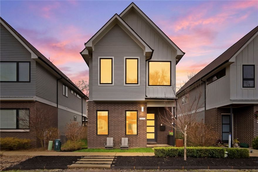 Experience the pinnacle of downtown living in this modern masterpiece located in the coveted Southside subdivision. Just a short stroll from the vibrant Bentonville Square, the 8th Street Market, and the new Walmart Home Office, this home is a sanctuary of contemporary elegance.

Inside, soaring double-height ceilings and expansive windows bathe the open-concept layout in natural light, highlighting the tactile warmth of authentic hardwood floors. The chef’s kitchen is a study in functional art with sleek quartz countertops and premium finishes.

Step outside to a private, nested patio—the perfect backdrop for alfresco evenings. This home is as efficient as it is beautiful, featuring solar panels (to be paid in full by seller at closing) and Nest smart technology. The upstairs primary suite offers a spa-like retreat with a deep garden tub and massive walk-in shower. Live at the intersection of culture and comfort, moments from Crystal Bridges. This is the definitive Bentonville luxury lifestyle.