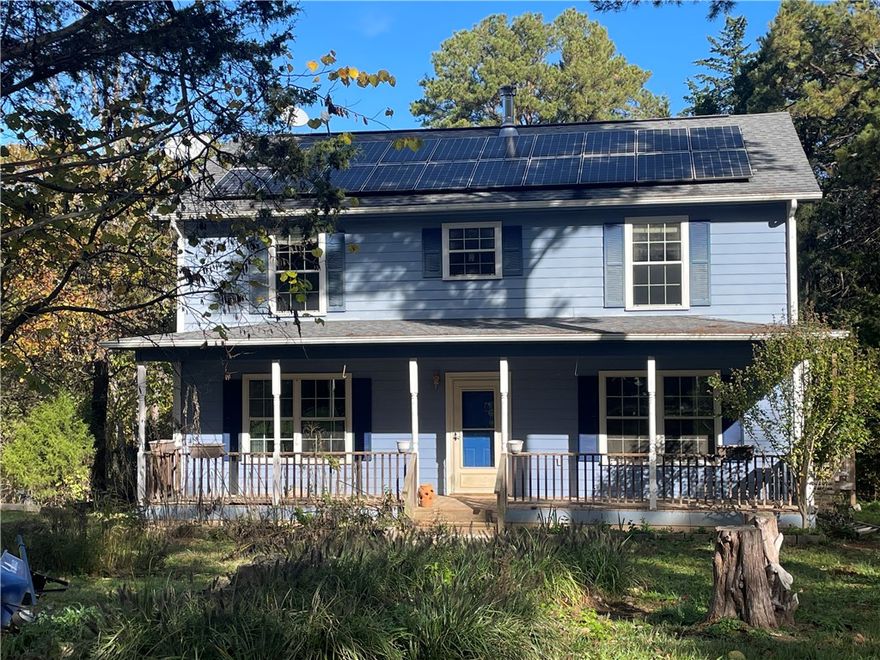 Roomy farmhouse on 6.6 acres (Lots 12 & 13), barn, chicken yard, and outbuildings. Conveniently located far enough away from the hustle & bustle of Eureka Springs, but close enough for markets, and where entertainment, dining, and outdoor adventure await around every corner. Property includes a garden area, barn with stalls originally used for goats, a chicken yard with hen-house, a couple of smaller Dirksen sheds, and there’s a sunroom at the back of the house for getting plants started early.   .....    Solar panels keep the utility bills to minimum, and these will be paid off at closing by seller. Roof under panels replaced <5yrs ago....  Covenants are very light. ...  Sellers are motivated and ready for offers AND they are happy to provide a Home Warranty Policy to buyer!   ...    25' x 30' x 12' steel "Shop in a Box" on-site for purchase separately. Sellers are still moving things out and cleaning up. Some items in barn, & galvanized tubs in garden do not convey.