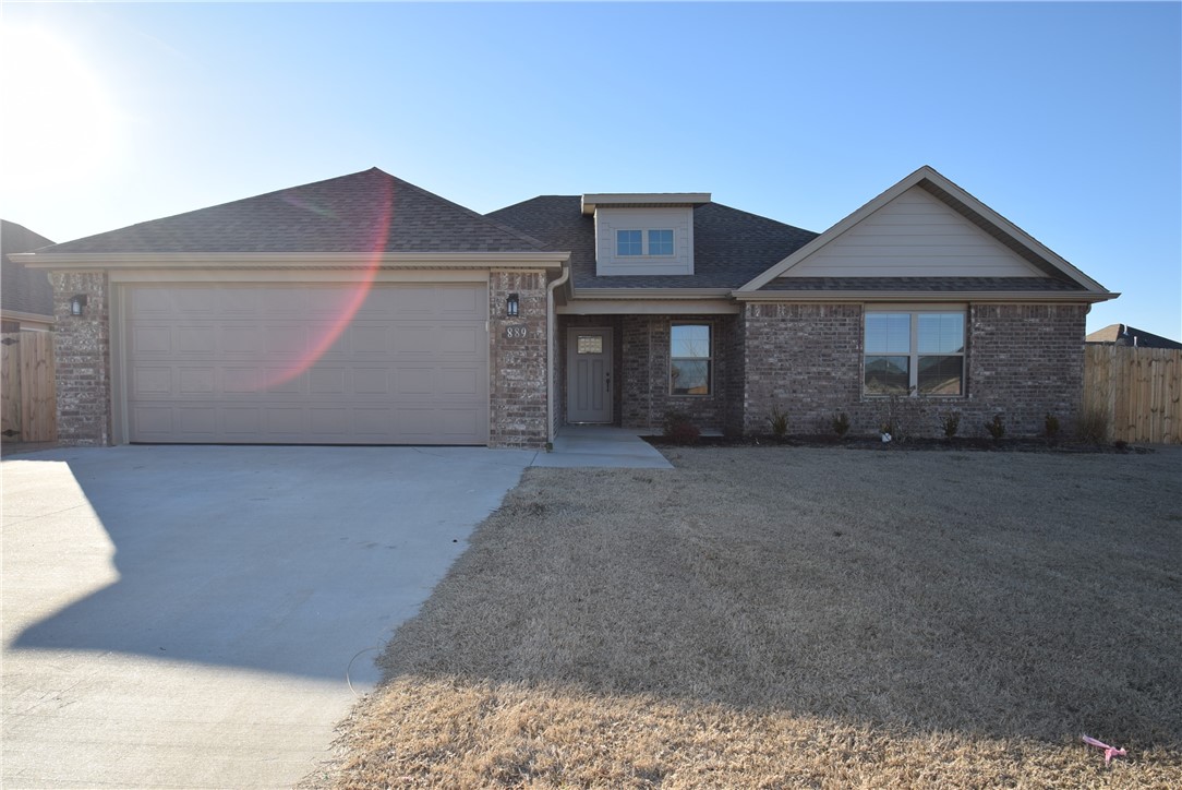 Welcome to Hickory Meadows! This luxurious, yet affordable neighborhood is idealy located on a spacious corner lot in Springdale's most coveted school district, is convenient to Tyson Headquarters, Siloam Springs and central to all that NWA has to offer! The Birchwood plan is an open dining/living concept perfect for entertaining. As you enter, you're greeted with wood floors throughough, and a stunning fireplace. The kitchen serves as the hub for serving family and friends delicious home cooked meals and boasts custom cabinets, granite counters, and stainless appliances. The Master Suite provides the perfect retreat for a long day the relaxing whirlpool tub and separate shower. You'll aslo appreciate a generous sized walk-in closet. Crown molding, gas fireplace, cased windows, gutters, sodded lawn, fully fenced back yard, and professional landscaping complete the home! And, your summers will be spent enjoying the amazing resort style community pool with pavilion and playground.
