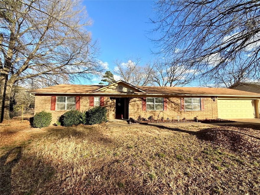 Experience a home designed for both relaxation and everyday living. This 3-bedroom, 2-bathroom house offers a great layout featuring two separate living areas. The front living room provides a welcoming entry, while the back living room serves as the heart of the home with its wood-burning fireplace. The kitchen includes an eat-in area, plus a dining space for hosting family and friends. The large laundry room comes with a sink and built-in cabinets, making it a perfect pantry or extra storage space. The primary suite offers a walk-in closet and full bath, while the other bedrooms are a good size with plenty of closet space. Outside, the large, fully fenced backyard and covered patio provide the perfect setting for hanging out. The attached 2-car garage also includes a dedicated storage room for your tools and gear. Prime Location: This home is in a great spot, located just minutes from the hospital and Millard Henry Clinic. You will also love being only a short drive from the fun and beauty of Lake Dardanelle.