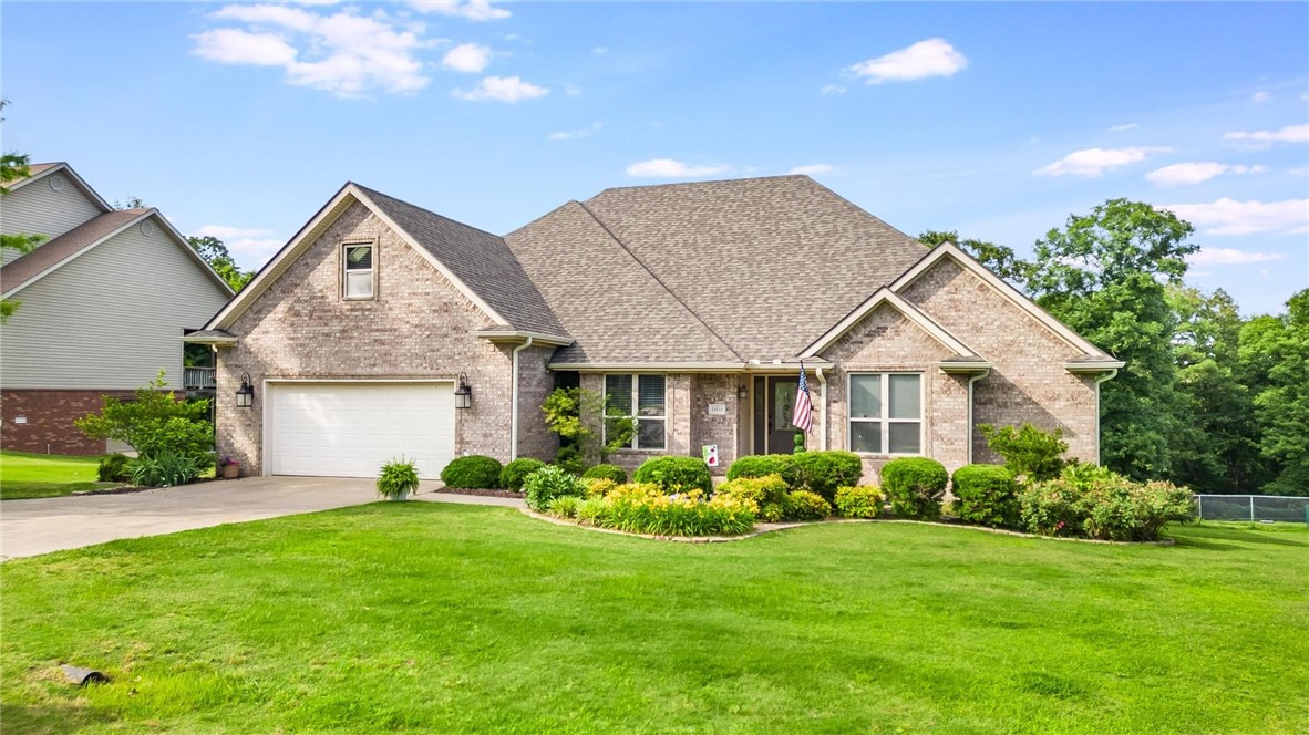 Nestled on a tranquil 0.54-acre lot in a serene rural neighborhood, 14864 Park Ridge Drive in Lowell, Arkansas, offers a spacious and energy-efficient home perfect for comfortable living. This custom-built 3-bedroom, 2.5-bathroom residence boasts 2,267 square feet of living space, combining modern amenities with rustic charm.
The open-concept floor plan features soaring vaulted ceilings and radiant heat flooring, ensuring warmth and comfort throughout the year. The kitchen is a chef's delight, equipped with granite tile countertops and ample storage space.
The expansive patio overlooks a picturesque yard, providing an excellent setting for outdoor entertaining or relaxation. With its combination of comfort, efficiency, and customization options, this home is a rare find in the Lowell area.
Carpet allowance of $2500