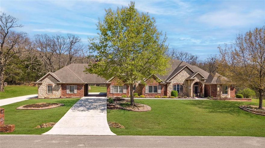 Welcome to 730 Winding Spring Dr, a stunning custom-built home on 2 acres + neighborhood pool. 70 concrete piers prior to construction for superior foundation stability. The interior features an open & inviting floor plan highlighted by Brazilian cherry hardwood floors in entry, LR, DR & hallways. Extensive trim &crown molding thoughout. The grand living room is anchored by soaring 12' coffered ceiling & floor to ceiling windows creating natural light & view of wooded area behind the home. Enclosed sunroom is adjacent  to living/informal dining area. Chef's dream kitchen has large island, 6 burner gas cooktop w/ exhaust, dbl ovens, abundant counter space & cabinets, top-of-the line Electrolux appliances.  Walk-in pantry w/ bev frig.  Informal dining + breakfast bar.  Formal dining room. 2 car garage w/ apartment above. Owners' suite includes soaking tub, dbl vanities & luxurious walk-in closet w/ buillt-ins & pull-down rods for easy access to your wardrobe. Room for multi-generational living.