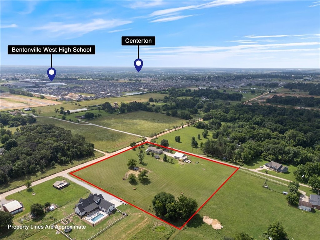 Country living in the City. What a beautiful setting and a great place for horses with pond on the edge of Centerton with easy access to I-49 or Centerton. Not to mention trees galore, enjoy your own Apple, Plum, Peach and Pear as well as Maple and Red Buds. This well kept Clayton home. Large 40X40 garage and workshop with 10X40 attic storage and 10X30 added lean to west for tractors etc. The property has natural gas, electric and water available at road frontage. Currently a 500' well with a new 2 HP pump supplies plenty of water for the residence and property. Start living the Country life today!