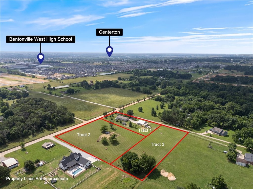 Country living in the City. What a beautiful setting and a great place for horses with pond on the edge of Centerton with easy access to I-49 or Centerton. Not to mention trees galore, enjoy your own Apple, Plum, Peach and Pear as well as Maple and Red Buds. This well kept Clayton home. Large 40X40 garage and workshop with 10X40 attic storage and 10X30 added lean to west for tractors etc. The property has natural gas, electric and water available at road frontage. Currently a 500' well with a new 2 HP pump supplies plenty of water for the residence and property. Start living the Country life today! Price includes Tract 1 and 2.