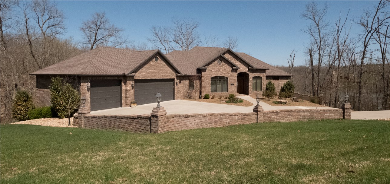 Stunning Lake Loch Lomond home!Gorgeous views!Soaring ceilings,Walls of windows,transoms,Open Floor plan,Great Rm w/FP,Amazing kitchen,Library/study,Master BR w/double crown moulding&amazing closet,bath w/2 sinks,whirlpool & sep shower/guest bdrm&bath,Formal & Informal DR,Total 5 bdrms,4.5 baths,3car gar,Incredible Covered Veranda leads to flagstone patio w/firepit,waterfall,Screened covered Deck,private boat dock,enjoy lake year round!Lower Level=Great rm w/wet bar,media rm,3 bdrms 2 baths,extra storage,