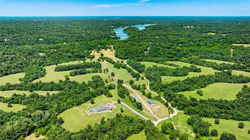 Explore the exceptional 220.26-acre parcel at 14111 Gordon Hollow Rd, offering an unparalleled opportunity for development. This expansive property boasts a diverse landscape with sweeping panoramic views from its hills. Enhance your project with its abundant natural resources, including 6 ponds, 3 natural springs, and a variety of hardwoods that enhance the picturesque setting. Benefit from essential utilities and infrastructure, such as city water access and an 80ft natural gas easement. The property also features well-maintained dirt roads managed by Gravette, ensuring accessibility and convenience. Located just 15 minutes from Bentonville with easy interstate access, and close proximity to a nearby lake and golf courses, this unique property offers a strategic location for visionary developers seeking to establish a distinguished residential or mixed-use development. Seize this opportunity to transform natural beauty into a thriving community and create lasting value in this idyllic setting.