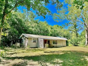 Tucked away in the quite hills outside of Marble Falls is this sweet square of 19.56 acres ready to be your getaway or off-grid living place. Featuring an investment house with 2 bed 1 bath house, year round springs, garden area & a wet weather spring in the front yard, the opportunities are endless! Also, a large shed built off the ground, the abundant wildlife and only a short distance of 2 miles to Cove Creek & Buffalo River!Call today to see you next investment opportunity!