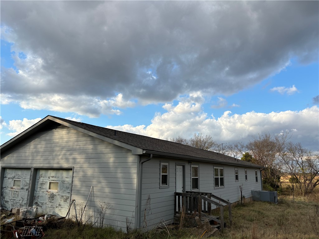40 acres of beautiful farm land and your homestead are waiting for you! This house may need work but it's definitely worth doing at this value. Newer roof, siding and windows give you a head start and you can redo the interior to your own liking. This home sits back from the road for great privacy and is surrounded by some of the most picturesque pasture views you can imagine. Priced below the land value itself, this is such a deal. Only 8 miles into Decatur and 40 minutes to Downtown Bentonville but feels like a world of it's own. Come see for yourself and be ready to fall in love with this amazing homestead! Sold As-Is. Also listed under Land, MLS #1291833
