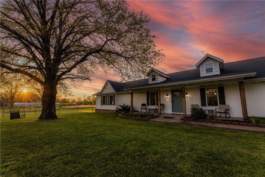 Welcome to The Bentonville Trailside Homestead, a beautifully curated modern farmhouse where wide-open country living meets city convenience. Located 15 minutes to the Bentonville Square, easy access to I-49, and only .5 miles to the Snowbird Trailhead and Back 40 Trail System, this property truly has it all. Set on acreage with sweeping Ozark skies, this home features spacious living areas, a fully equipped kitchen, and a game room perfect for gatherings. A large attached garage and a detached garage offer exceptional storage and workspace, while a cooled shed adds a versatile bonus space for hobbies. Outside, enjoy a private pool, expansive patio, fire pit, and sunset views. Mountain biking, country hobby living, and city convenience all in one. This is the lifestyle property families dream about. Offered fully furnished and operating as a successful short-term rental, it's also a turnkey investment opportunity. Please note: the home has been remodeled to have 4 bedrooms, but there is a 2 bedroom septic system.