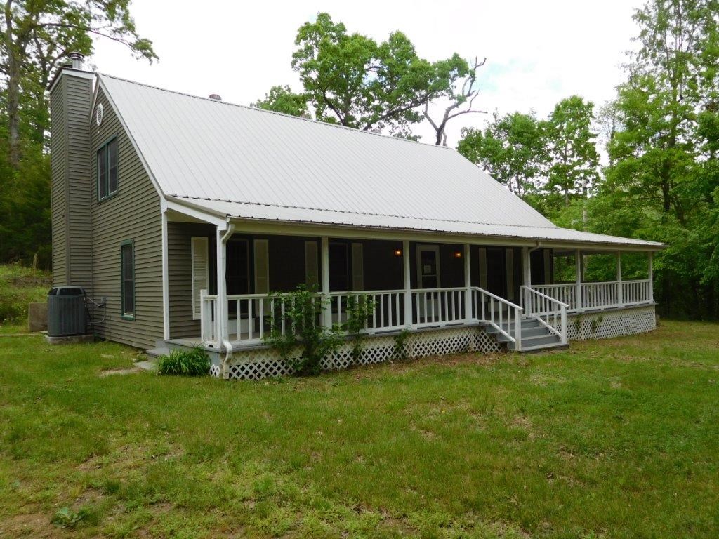 Spacious home on 2 +/- acres in Monte Ne near the lake. Large kitchen and over sized living areas for entertaining. Extra storage space in the well house. Fireplace in the master bedroom in addition to one in the den area. Sold as-is, no repairs.
