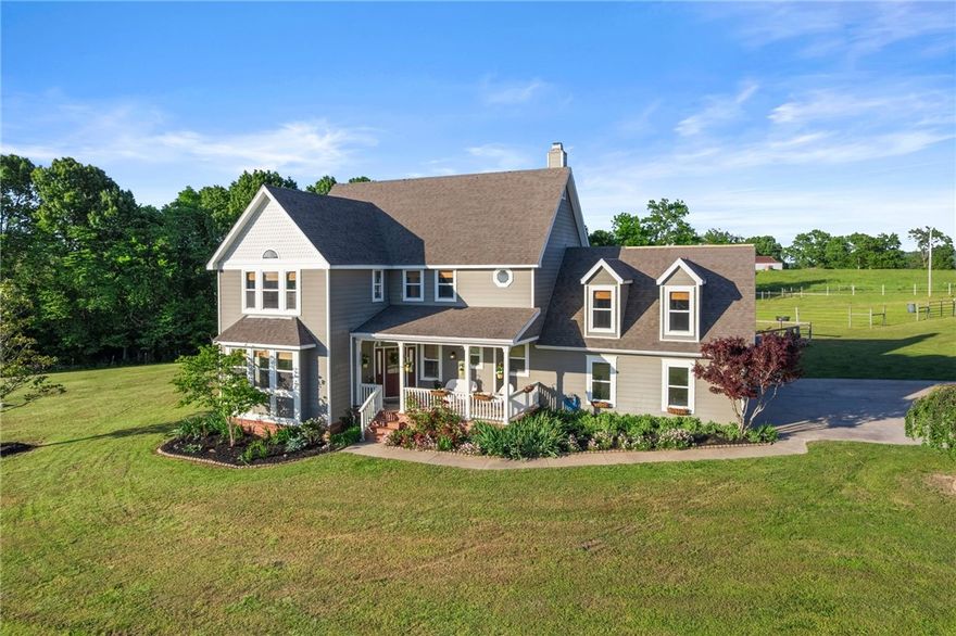 Experience the breathtaking landscape of over 21 pristine acres offering a 1,440 sqft 3 stall barn (w/ individual paddocks) w/ tack room, & pull through hay storage; 15x21 Lean-to w/ 100 hay bale storage; private pond stocked with Bass, Catfish, & Bluegill; Spacious Outdoor Plumbed Kitchen fully equipped to host any outdoor event featuring a large gas grill, restaurant style vent-hood, SS refrigerator, built-in waste bin drawer, wired for sound, A/V receiver, outdoor TV, hot tub, Trex® Decking, pergola, & a custom concrete fire pit. Step inside this oasis offering 3 beds, 2.2 baths, & a Large Bonus Room, solid oak flooring, tons of natural light, & views for days! Recently updated kitchen w/ stunning Quartzite, clear view cabinetry, built-in wine rack, & more! Make your way up the custom staircase to explore the sizable primary suite w/ gas fireplace, deep soaking tub, & private office. Hardwired 14.5kw whole house Generac Generator, 6 person in-ground steel storm shelter & New Roof 5/25!