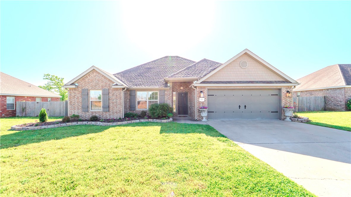 Well-maintained 4 bed, 2 bath home in the heart of Bentonville! Built in 2010, this home offers a spacious split-bedroom layout filled with natural light. The welcoming living room features a cozy gas fireplace, perfect for relaxing evenings. The kitchen provides ample cabinet space, a pantry, and a functional layout for any home chef. The generously sized bedrooms offer comfort and flexibility, while the primary suite includes a walk-in closet, soaking tub, and separate shower.
Step outside to a fully fenced backyard designed for both relaxation and fun! You'll find a covered patio with a mounted TV, a dedicated hammock area, a wooden storage shed, and an above-ground saltwater pool—ideal for entertaining or unwinding after a long day.
Located just minutes from the new Walmart Home Office Campus, shopping, dining, downtown Bentonville, and all that NWA has to offer. Enjoy easy access to trails, top-rated schools, and major highways. This home is move-in ready and full of potential!