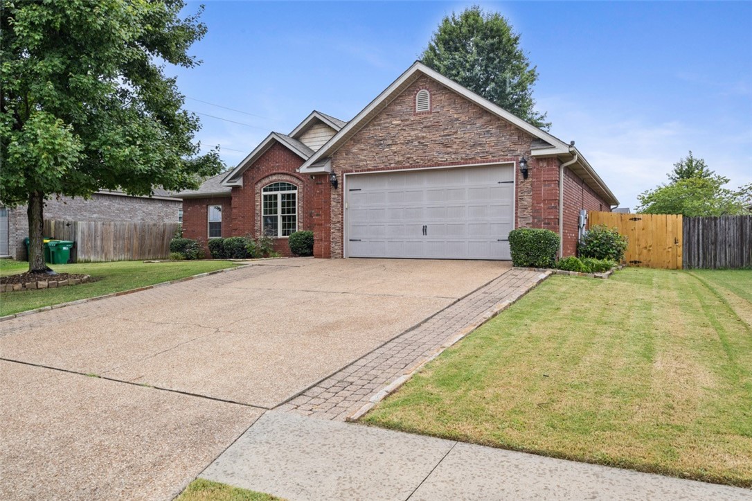 This stunning 4 bedroom, 2-bath home offers a dynamic, split floor plan that combines style, comfort and efficiency. With soaring ceilings, elegant crown molding, energy-efficient windows and an exceptional outdoor living area, this home has it all!
The design includes a spacious family room, a bright dine-in kitchen, a generous master suite and a versatile 4th bedroom that can easily be used as an office.
Throughout the main living areas, you'll find beautiful hand-scraped hardwood floors, including in the family room, which boasts an arched doorway and a cozy gas log fireplace.
For those who love to entertain, the covered porch overlooks a beautifully landscaped yard. The outdoor space features a concrete patio, a native stone fireplace and a privacy fence, creating a perfect setting for relaxation and fun.
Additional perks include a poly-coated garage floor, built-in storage, a power lift that automatically moves items to the spacious attic and an irrigation system with its own meter for efficient watering.