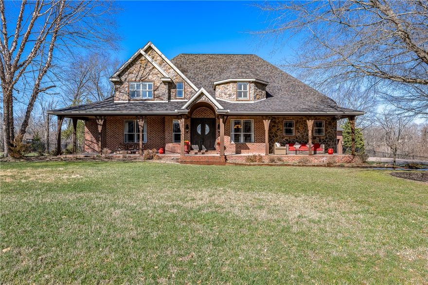 Rare Two-Story Luxury Craftsman Estate serenely nestled in prestigious Talamore. Impressive design w/hardwood floors & designer cabinetry throughout. 1stFloor Primary Suite w/decorative ceiling. Primary Bath features granite vanities, jetted tub, spa shower, WC, trav. flrs, walkin closet. Upstairs: Dedicated Guest Rm w/ Hall Full Bath, 2 BdRms (jack&jill bath), Bonus (5thBR) & Media Rm (6thBR). Downstairs Study/Office Rm (7thBR), 2 Full Baths, Open Formal Din Rm, Gorgeous Gourmet Island Kitchen w/SS, granite & new travertine flooring. Heart of Home is the 2 Story Family Rm w/stunning fireplace flanked by windows & leads to relaxing outdoor areas w/backwood nature views. Generous 3-Car Garage w/cabinetry & pulley lift system for storage. Nearly 4 acres-Lawn/Landscape wellwater sprinkler. Holiday Trimlights w/multic LEDs-warranty! Entertainer backyard pool w/slide, covered pavilion w/fireplace, & outdoor kitchen is all house adjacent. This remarkable estate provides backdrop for grand lifestyle living. Welcome Home!