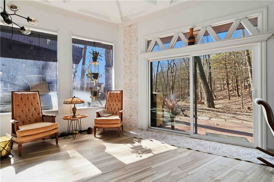 Totally one-of-a-kind two-unit property in Lost Bridge Village, fully renovated with luxury finishes in 2024–2025 and built directly into a natural cave/bluff. Exposed cave walls, stacked rock accents, soaring ceilings, solid concrete ceilings, and a dramatic spiral staircase make this home unforgettable. Upgraded appliances include a convection oven, plus an induction cooktop in the income-producing Airbnb unit. Grass roofs add incredible character.

Situated on approximately .66–.69 acres (rare for LBV), enjoy usable yard space, two ponds, three decks including a rooftop deck, outdoor cave bar/patio, seasonal waterfall and stream, and seasonal lake views. Strong short-term rental potential with parking for 7+ vehicles and trailer space.

All with full Lost Bridge Village amenities: sewer, water, pool, clubhouse, library, marina, beach, and church. Truly a showstopper!