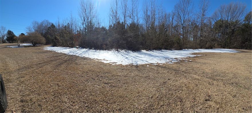 Nice level parcel located in the Dover area offering approximately 1.51 acres per records. Property features a mostly rectangular layout with generous frontage and depth. Overhead electric and communication lines visible on the property, providing convenient proximity for future utility connection (buyer to verify availability and costs.) Quiet rural setting with convenient access via AR-7, while remaining within reasonable driving distance to Russellville and surrounding amenities. Excellent opportunity for a homesite or investment. Buyer to verify utilities, zoning, and intended use.