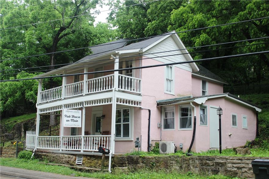 Eureka Springs at it's finest!  This charming home is located in downtown Eureka Springs.  Within walking distance to shopping, great restaurants, local parades and many wonderful annual events.  It is currently being used as an Airbnb.  1 Unit on the main floor and 1 unit upstairs.  Each has its own private entrance.  Upstairs unit has a BR, kitchen, bathroom, and stackable washer and dryer.  Main floor unit has 2 BR's, Kitchen, bathroom, living room and laundry room.
It is zoned commercial which makes this property so special.  You could live upstairs and have a retail space or office on the main floor.  Great options in this adorable home.  Listed under Commerical ML 1348124