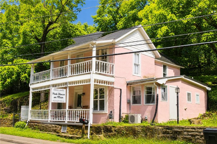 Eureka Springs at it's finest!  This charming home is located in downtown Eureka Springs.  Within walking distance to shopping, great restaurants, local parades and many wonderful annual events.  It is currently being used as an Airbnb.  1 Unit on the main floor and 1 unit upstairs.  Each has its own private entrance.  Upstairs unit has a BR, kitchen, bathroom, and stackable washer and dryer.  Main floor unit has 2 BR's, Kitchen, bathroom, living room and laundry room.
It is zoned commercial which makes this property so special.  You could live upstairs and have a retail space or office on the main floor.  Great options in this adorable home.  Listed under Commerical ML 1348124