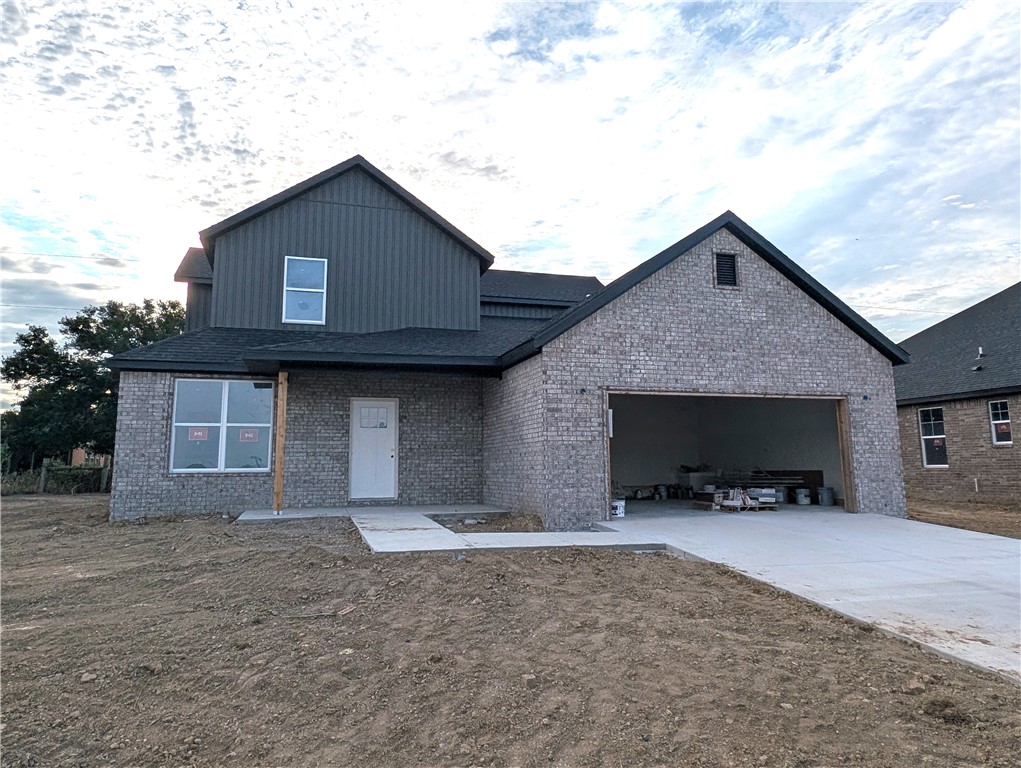 Welcome to this beautifully crafted new construction home in the heart of Gentry, Arkansas! Do you have a big family and need tons of space? This one is for you! This home offers both style and functionality. The spacious kitchen is a standout, with quartz countertops, a large island, stainless steel appliances, and custom cabinetry. A split floor plan provides added privacy, while the ceramic tile shower adds a touch of luxury. Outside, enjoy a versatile space ideal for family gatherings and weekend barbecues. Conveniently located near Gentry High School, shopping, and local favorites like the Wooden Spoon, this home combines comfort, quality, and a prime location.