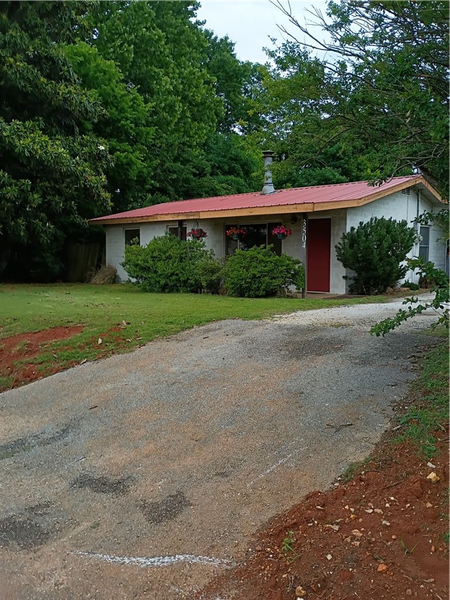 Opportunity is knocking with this 1+ acre-sized lot and 1300+ home, offering highway frontage. Located across from Mt. Comfort Square and just minutes away from the University of Arkansas, downtown Fayetteville, trails, shopping, dining and nearby elementary and preschool options. This site offers endless potential, don't miss your chance to own this desirable property.