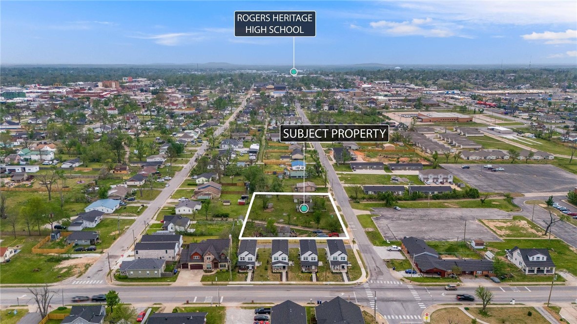 Located in a rapidly evolving area, this .71-acre property offers an exceptional investment and development opportunity, comprising three adjacent lots with alley access and public utilities. Walking distance to Rogers Activity Center and anywhere Downtown Rogers, close to the Razorback Greenway Trail system. Surrounding development is on the rise, time to capitalize on its potential. Whether envisioning single-family homes, multi-family units, or a tiny home community, this flexible property is ready for transformation. The owners are clearing all cars and getting estimates for demo, making it easier to move forward with your vision as it’s a prime location for an innovative residential project. While the existing structures hold little value, you may have vision for them, but the true potential lies in the land itself. Positioned near Railyard Park and major corridors, this site is ideal for reshaping downtown Rogers. Listed as land on MLS 1299013 —seize this rare opportunity today!
