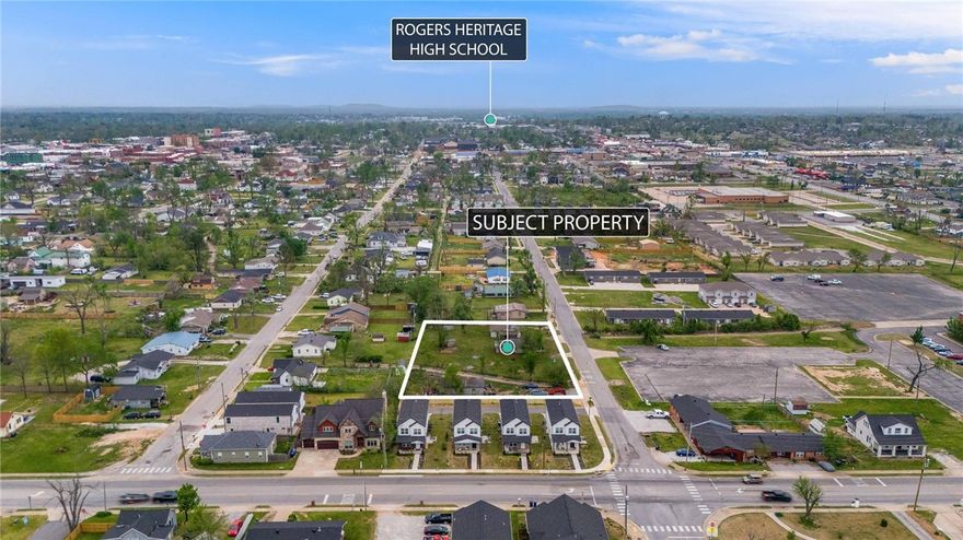 Located in a rapidly evolving area, this .71-acre property offers an exceptional investment and development opportunity, comprising three adjacent lots with alley access and public utilities. Walking distance to Rogers Activity Center and anywhere Downtown Rogers, close to the Razorback Greenway Trail system. Surrounding development is on the rise, time to capitalize on its potential. Whether envisioning single-family homes, multi-family units, or a tiny home community, this flexible property is ready for transformation. The owners are clearing all cars and getting estimates for demo, making it easier to move forward with your vision as it’s a prime location for an innovative residential project. While the existing structures hold little value, you may have vision for them, but the true potential lies in the land itself. Positioned near Railyard Park and major corridors, this site is ideal for reshaping downtown Rogers.  Listed as land on MLS 1299013 —seize this rare opportunity today!