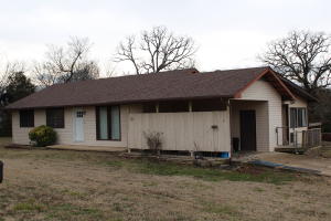 Priced to sell this three bedroom, two bath home sits on a level corner lot. Fenced back yard and large sun porch, outbuilding and carport. Quiet subdivision just one mile from Wal-Mart and City Park. Large built-in cabinets in the Living Room.