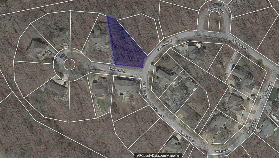 Larger corner lot with SEWER! Fantastic location, right across the street from the Metfield Clubhouse. Two area golf courses. Close to the Metfield pool. Lovely trees. And convenient to all Bella Vista has to offer... golf, lakes, tennis, pools (indoor and outdoor), club houses with scheduled fitness classes and clubs, and don't forget the world renowned trail system!