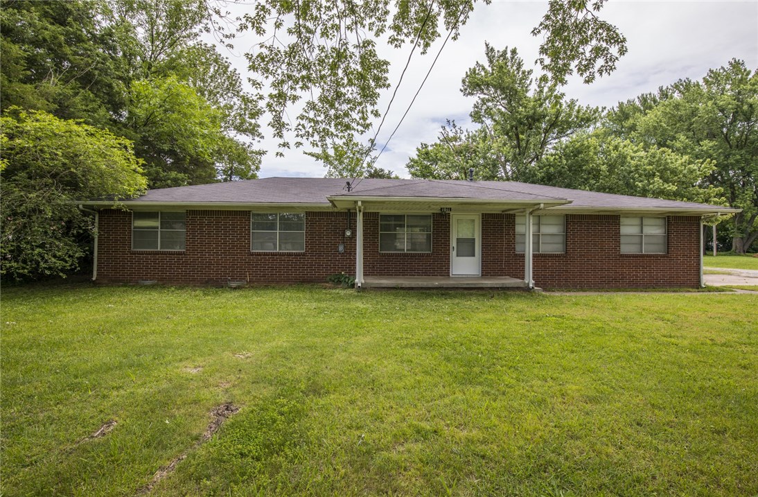 Great location!!! Well maintained older home close to downtown Bentonville, Fresh paint, 3 bedroom 2 bath has new laminate wood plank flooring and tile throughout. Large yard and over sized 2 car garage.