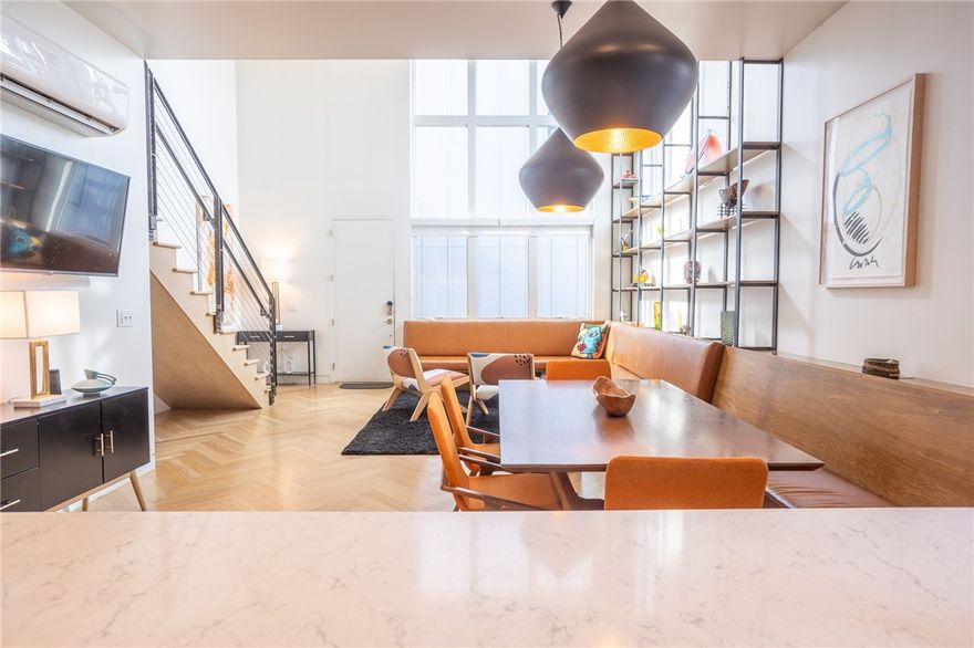 Located in the heart of downtown Bentonville, this striking three-level contemporary townhouse offers clean architecture, thoughtful design, and walk-to-everything convenience. Flooded with natural light, the interior features built-in Frank Lloyd Wright Style furniture and custom shelving that enhance both form and function, creating spaces that feel curated, modern, and effortlessly livable. The open layout is ideal for entertaining with a Scandinavian style kitchen and white oak flooring, while the fenced back courtyard provides a private outdoor retreat rarely found downtown. With three bedrooms, two and a half baths, a convenient third floor bonus room, and a spacious two-car garage, the home balances style with practicality. Enjoy immediate access to the Razorback Greenway, dining, shopping, the square, and Bentonville’s vibrant arts and culture scene, all just steps from your front door. This is downtown living at its most refined, designed for those who value architecture, light, and location.