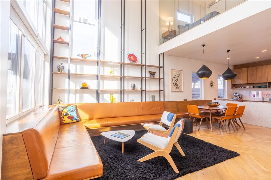 Located in the heart of downtown Bentonville, this striking three-level contemporary townhouse offers clean architecture, thoughtful design, and walk-to-everything convenience. Flooded with natural light, the interior features built-in Frank Lloyd Wright Style furniture and custom shelving that enhance both form and function, creating spaces that feel curated, modern, and effortlessly livable. The open layout is ideal for entertaining with a Scandinavian style kitchen and white oak flooring, while the fenced back courtyard provides a private outdoor retreat rarely found downtown. With three bedrooms, two and a half baths, a convenient third floor bonus room, and a spacious two-car garage, the home balances style with practicality. Enjoy immediate access to the Razorback Greenway, dining, shopping, the square, and Bentonville’s vibrant arts and culture scene, all just steps from your front door. This is downtown living at its most refined, designed for those who value architecture, light, and location.