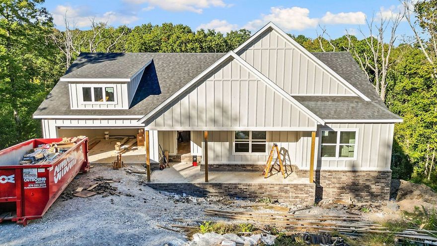 This stunning home showcases 7" hand-scraped engineered wood floors throughout—including closets—and stylish tile in the laundry and baths. The inviting living area features an electric fireplace accented with shiplap for a modern, cozy touch. Enjoy the efficiency of Low-E double-paned windows and the elegance of custom cabinets topped with 3 cm Black Pearl granite throughout. The kitchen is a true highlight, featuring stainless steel appliances and sleek finishes. Black hardware adds a cohesive, modern look across the home. Step outside to a spacious back deck overlooking a gorgeous view—the perfect spot to relax or entertain. Complete with a 2-car garage, this home blends quality, comfort, and beautiful design in one perfect package!