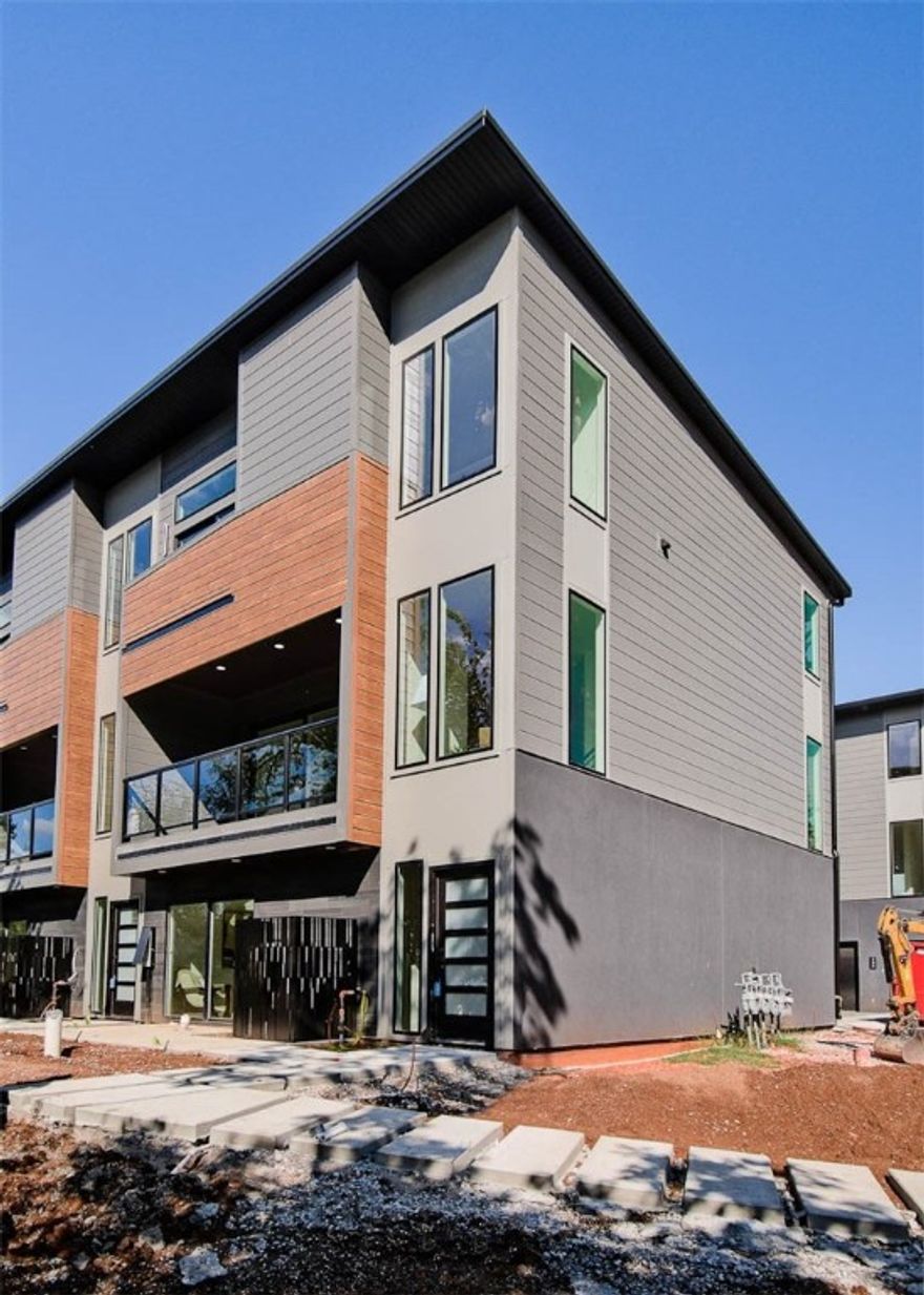 MOVE-IN READY! Modern living located across the street from Airship Coffee! Situated near the Crystal Bridges trail and the downtown square, this brand new corner unit offers both convenience and contemporary design. The property includes an attached 2-car garage and a community bike wash station, perfect for outdoor enthusiasts. Additional neighborhood amenities feature an outdoor grill and a fire pit, ideal for social gatherings. The contemporary kitchen is a highlight, featuring European cabinetry, exquisite quartz countertops, and a waterfall island. With modern fixtures and high-end finishes throughout, this condo exemplifies quality. Enjoy the elegance of glass balconies and the comfort of 3 luxurious bedrooms. The condo also includes 3.5 baths, designed with style and functionality in mind. Experience the ultimate luxury lifestye with this exceptional property. Additional units are available.