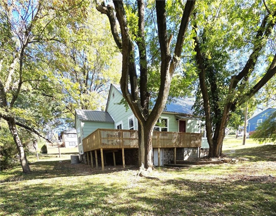 Beautifully updated home on a double corner lot. Brand new metal roof, all new windows, new electric, gorgeous refinished hardwood floors, granite countertops, new appliances, freshly painted, and more!  The carport in addition to an outbuilding is perfect for storage or parking. Walk-in access to the basement / tall crawl space is great for additional storage or storm protection. Check this out, priced to sell quick!