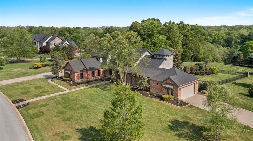 From the moment that you arrive at this Talamore property, you will be drawn in to the spectacular 3.09 acre property and taken with this brilliant architecturally designed home. The main level has a spacious open floor plan with high ceilings, great natural light, 2 bedroom en-suites, private study, open dining rm & vaulted coffered ceiling great rm with floor-to-ceiling limestone fireplace. The gourmet kitchen features exquisite millwork, marble countertops, hidden walk in pantry & high end stainless steel appliances. The primary suite offers patio access, sitting area and stunning master bath with separate vanities, 2 walk-in closets & custom shower and sunken bath. The fully equipped theater room features stadium seating, custom wet bar w/lit bar top and surround sound system. This estate boasts incredible living spaces inside & outside. The expansive covered veranda has a wonderful outdoor fireplace and built in grilling station- all overlooking the resort-style gunite pool w/tanning shelf, and pool fountains.