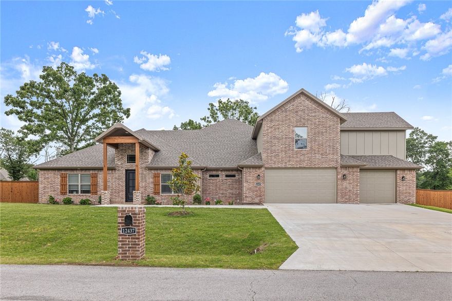 Beautiful, like new home on over 1 Acre in Rogers! This 4 Bedroom home built in 2023 features an office, large outdoor living area, extra storage, & massive bonus room. Open living layout perfect for everyday living and entertaining. Living room with built ins, fireplace, and beamed ceiling. Spacious kitchen with dining area, large island, gas range w/potfiller, double oven, and butler's pantry. Large primary suite with private views, beautiful bath with soaking tub and walk-in shower, WIC connected to laundry. Mud room area with built in storage. 3 guest rooms on opposite side of home, 2 share a large bath w/double vanity, 3rd has private bath. Bonus upstairs has room for everything! Covered patio w/fireplace has ample room for seating, dining & grilling. Your large 1.04AC yard is fully fenced and ready for garden, activities, and more! 3 Car garage offers great storage/workshop space. Whole home water filtration system. Move in ready, Welcome home!