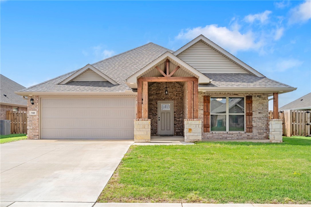 This like-new all-brick home is centrally located within 1o minutes to Downtown Bentonville and Coler Mountain Bike Preserve. Walking distance to Gamble Elementary, Gromsely Junior High and Bentonville West High School. This beautiful open floor plan offers 3 beds, 2 baths, and a 2-car garage. The gorgeous kitchen features plenty of storage, a large granite island, and a pantry. The spacious living room boasts a corner stone fireplace, while the meticulously maintained home showcases 10ft ceilings throughout and tile plank floors that exude warmth and charm. Lots of natural light creates a welcoming and airy ambiance. The primary bathroom is stunning with fully tiled showers and a double vanity. The primary bedroom offers direct access to the laundry room from the master closet. Step outside to enjoy the large fenced yard and covered patio. Fridge, washer, and dryer convey at no cost. Don't miss out on this incredible home!