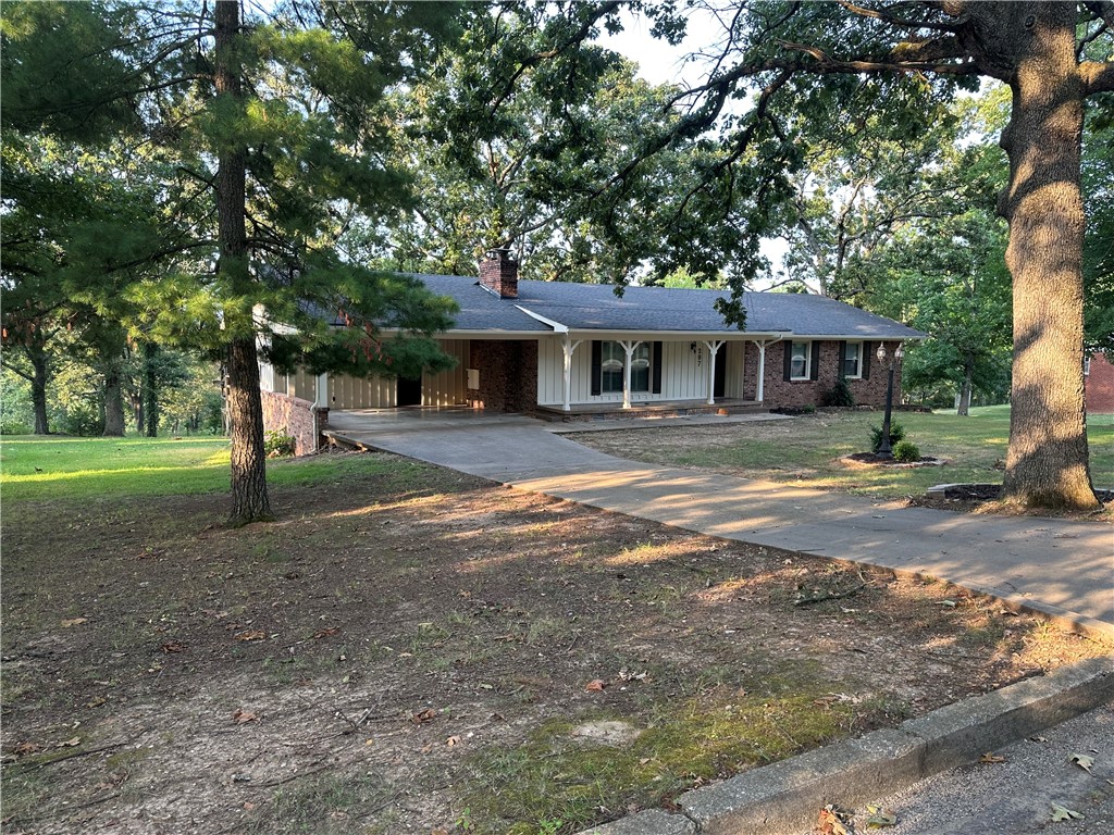 This home has been remodeled and is beautiful! The new kitchen has new cabinets and granite countertops and all new stainless appliances. The three new bathrooms have gorgeous tile, vanities and lighting.New laminate flooring and carpet throughout. All new paint inside and out with new light fixtures and a new water heater. New screens on screened in porch that over looks undeveloped land. All upgrades have been approved by City Inspector. Lots boost large mature trees providing shade for the whole yard.